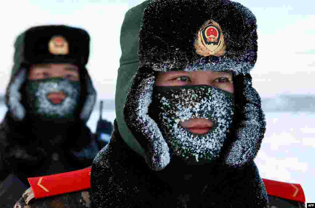 Chinese paramilitary police border guards train in the snow at Mohe County in the northeast Heilongjiang province, on the border with Russia.