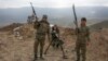 FILE - Armenian soldiers pose near a frontline in Nagorno-Karabakh, Azerbaijan, April 6, 2016. 