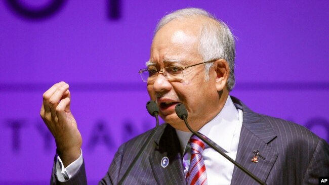 FILE - Malaysia's Prime Minister Najib Razak speaks during National Blue Ocean Strategy conference in Putrajaya, Malaysia, Aug. 16, 2016.