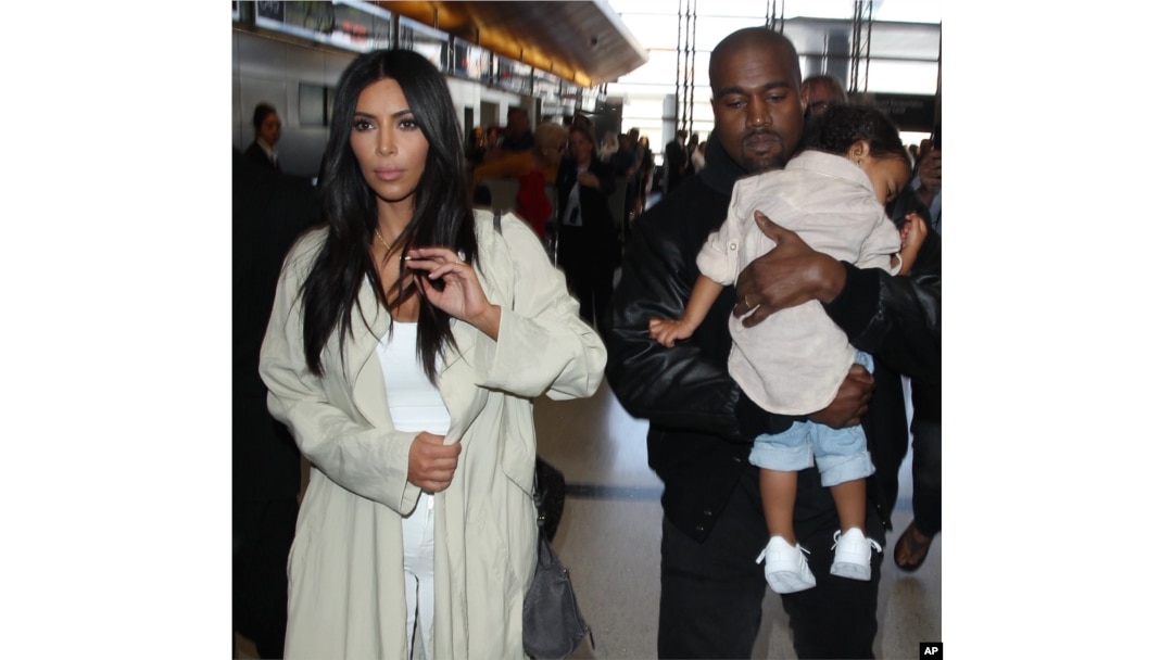 Kim Kardashian along with Kanye West and their daughter North are spotted at LAX Airport in Los Angeles, Ca, April 8, 2015.