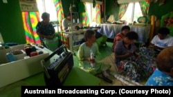 Women share stories while sewing at the Women’s Resource Center in Namotomoto, a village on the Fijian island of Nadi. (Australian Broadcasting Corp.)