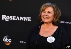 Roseanne Barr arrives at the Los Angeles premiere of "Roseanne," March 23, 2018 in Burbank, Calif.