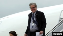 FILE - Steve Bannon arrives at Joint Base Andrews outside Washington, after a day trip to Lynchburg, Virginia, with President Donald Trump, May 13, 2017.