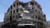 تصویر آرشیوی از ساختمان آسیب دیده در استان ادلب.