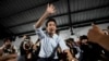 FILE - Former leader of Move Forward Party, Pita Limjaroenrat, center, shakes hands with his supporters at the party's headquarters in Bangkok, Thailand, on Aug. 7, 2024. 