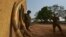 FILE - A scout (L) stands among elephant tusks confiscated from poachers in the past on February 4, 2016 at the Garamba National Park in north-eastern Democratic Republic of Congo (DRC) where in the past three years alone, over 100,000 African elephants have been killed for their tusks.