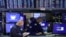 FILE - Traders work on the trading floor at the New York Stock Exchange in New York City, Dec. 28, 2021. 