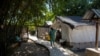 FILE - A medical worker walks through the cholera ward at a clinic run by Doctors Without Borders in the Cite Soleil neighborhood in Port-au-Prince, Haiti, Feb. 3,2023.