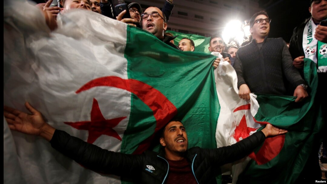 People celebrate on the streets after Algeria's President Abdelaziz Bouteflika has submitted his resignation, in Algiers, April 2, 2019. 