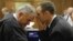 Oscar Pistorius talks with attorney Barry Roux, left, on the second day of trial, Pretoria, March 4, 2014.