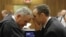 Oscar Pistorius talks with attorney Barry Roux, left, on the second day of trial, Pretoria, March 4, 2014.