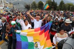 Ecuadorean indigenous leader Jaime Vargas rises his arms during a protest against Ecuador's President Lenin Moreno's austerity measures, in Quito, Ecuador, Oct. 8, 2019.