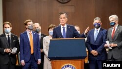 U.S. Senator Mitt Romney (R-UT) speaks as bipartisan members of the Senate and House gather to announce a framework for fresh COVID-19 relief legislation at a news conference on Capitol Hill in Washington, Dec. 1, 2020.