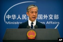 China's Ministry of Foreign Affairs spokesperson Wang Wenbin speaks during a daily briefing at the Ministry of Foreign Affairs in Beijing, July 24, 2020.