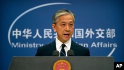 FILE - Wang Wenbin speaks during a briefing at the Ministry of Foreign Affairs in Beijing, July 24, 2020. On Tuesday, he urged Washington to "stop abusing export control measures" to hobble Chinese companies.