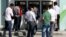 People line in front of automated teller machines in Hatay, Turkey, May 17, 2013.