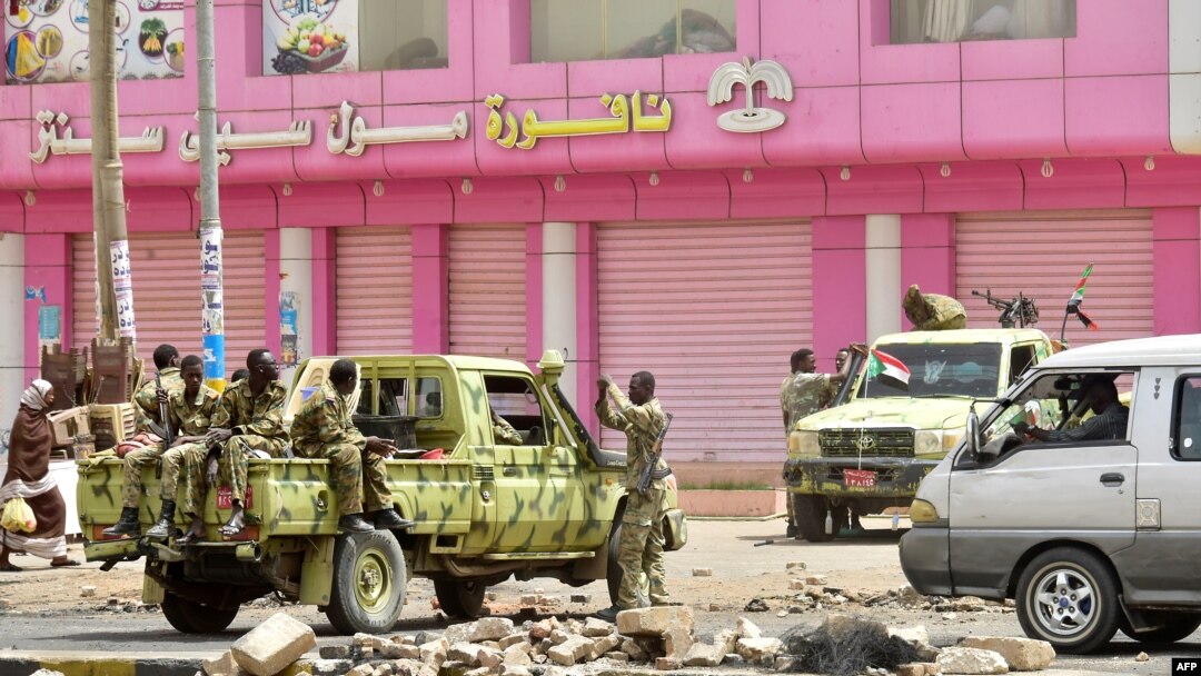 Sudanese soldiers stand guard a street in Khartoum on June 9, 2019. Sudanese police fired tear gas Sunday at protesters taking part in the first day of a civil disobedience campaign, called in the wake of a deadly crackdown on demonstrators. 