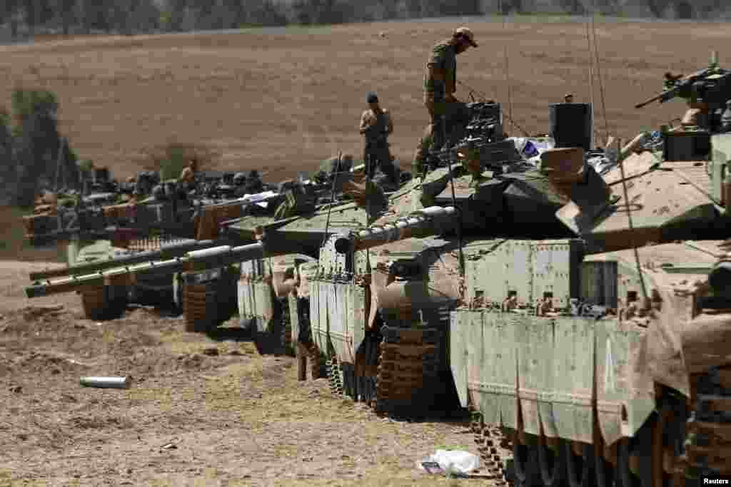 Israeli tanks at a staging area near the border with the Gaza Strip July 31, 2014.