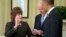 President Barack Obama watches as Vice President Joe Biden administers the oath of office to Julia Pierson, as she is sworn-in as the new director of the U.S. Secret Service, March. 27, 2013, in the Oval Office of the White House.