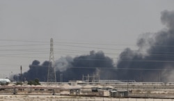 Smoke is seen following a fire at Aramco facility in the eastern city of Abqaiq, Saudi Arabia, Sept. 14, 2019.