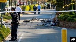 Bicycles and debris lay on a bike path after a motorist drove onto the path near the World Trade Center memorial, striking and killing several people, Oct. 31, 2017, in New York.