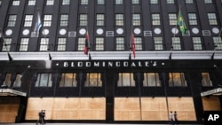 FILE - Bloomingdale's department store is seen with boarded-up windows during the coronavirus pandemic, in New York City, June 11, 2020.