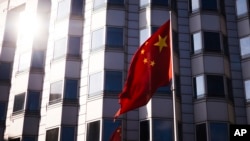 FILE - The Chinese flag waves in front of the country's embassy in Berlin on April 23, 2024. Officials in Berlin on July 31 said an investigation has determined that “Chinese state actors” were responsible for a 2021 cyberattack on Germany’s national office for cartography.