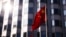 FILE - The Chinese flag waves in front of the country's embassy in Berlin on April 23, 2024. Officials in Berlin on July 31 said an investigation has determined that “Chinese state actors” were responsible for a 2021 cyberattack on Germany’s national office for cartography.