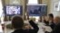 FILE - Members of the city commission to prevent the spread of coronavirus disease vote during a meeting via Zoom video link in Lviv, Ukraine, March 26, 2020. 