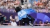 Refugee Team's Manizha Talash wears a cape that reads "Free Afghan Women" as she competes during a prequalifier battle in the breaking competition at the 2024 Summer Olympics on Aug. 9, 2024, in Paris.