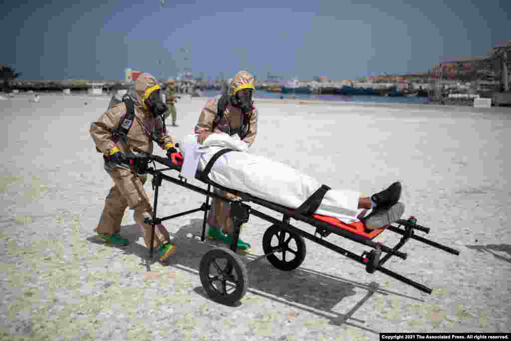 Members of the Moroccan Royal Armed Forces Rescue &amp; Relief Unit take part in a biochemical simulation organized by the U.S Defense Threat Reduction Agency, in the port of Agadir, Morocco.