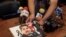 A member of the media displays an image of slain Mexican journalist Edgar Daniel Esqueda Castro, in protest, before the start of a press conference in San Luis Potosi, Mexico, Oct. 6, 2017. The body of Esqueda Castro, a freelance photographer, was found one day after armed men wearing uniforms abducted him from his home. 