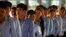 Cambodian students enter the courtroom before the hearings against two former Khmer Rouge senior leaders in the U.N.-backed war crimes tribunal on the outskirts of Phnom Penh, Cambodia, Nov. 16, 2018.