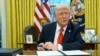 President Donald Trump speaks with reporters as he signs executive orders in the Oval Office at the White House, Feb. 10, 2025.