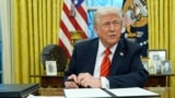 President Donald Trump speaks with reporters as he signs executive orders in the Oval Office at the White House, Feb. 10, 2025.