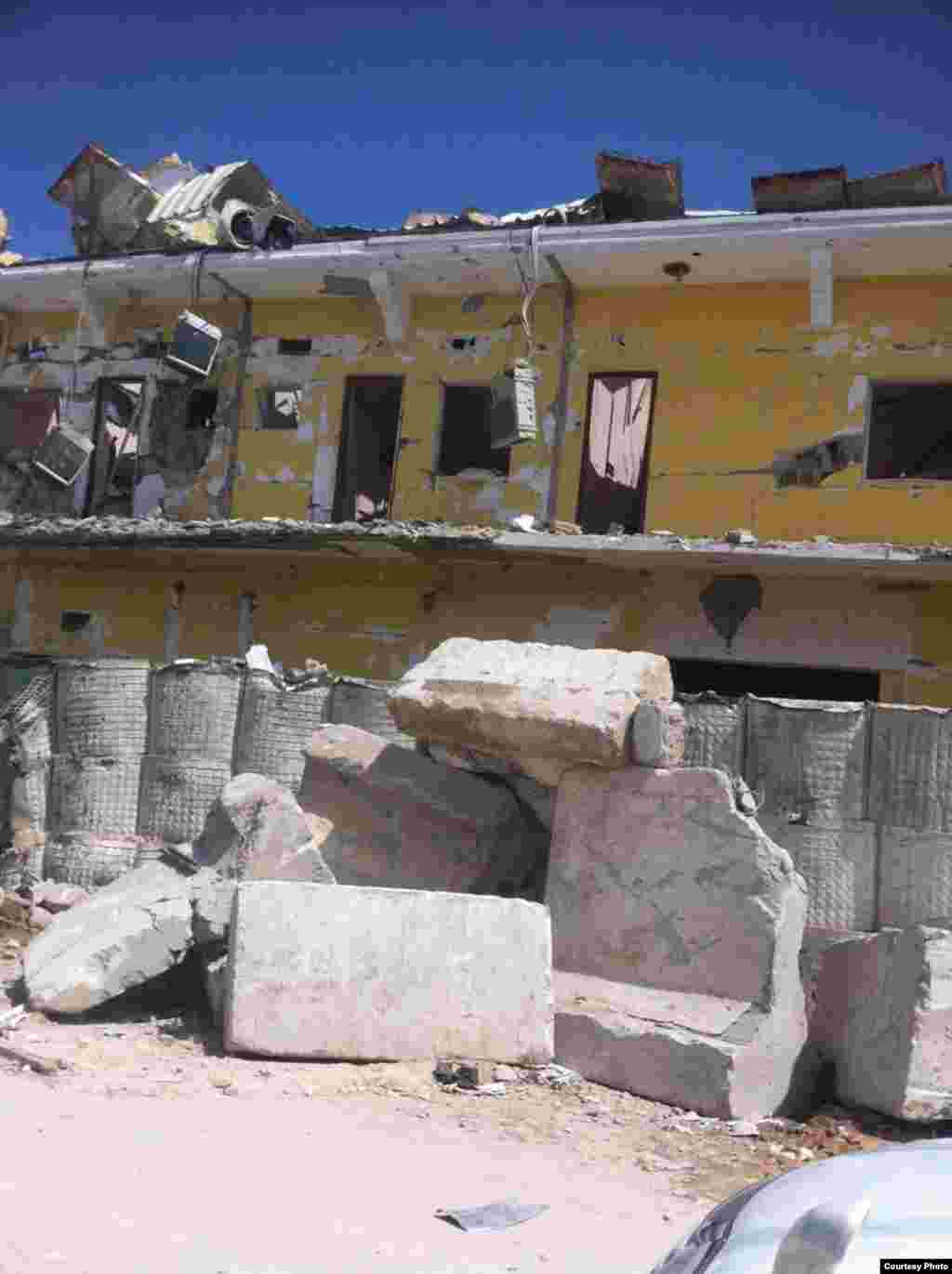 A photo, provided to VOA's Somali Service, shows the destruction of Naso-Hablod hotel and surrounding areas, in Mogadishu, Somalia, June 26, 2016. The photo was taken by a bystander who wished to remain anonymous.