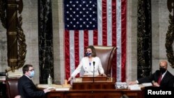 U.S. Speaker of the House Nancy Pelosi (D-CA) wields her gavel ahead of the final passage in the House of Representatives of U.S. President Joe Biden's $1.9 trillion coronavirus relief bill inside the House Chamber of the Capitol.