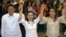 Newy proclaimed Philippine senators, from left: Sen. Francis Joseph Escudero, Sen. Grace Poe and Sen. Loren Legarda raise hands at the National Board Canvassing Center in suburban Pasay, south of Manila, May 16, 2013. 
