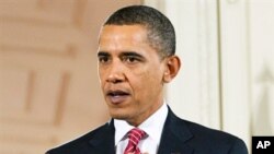 President Barack Obama speaks during a joint press conference with Indian PM Manmohan Singh (not pictured) at the White House, 24 Nov 2009