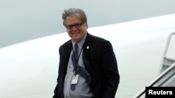 White House Senior Counselor Steve Bannon arrives at Joint Base Andrews outside Washington, after a day trip to Lynchburg, Virginia, with President Donald Trump, May 13, 2017.