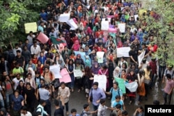 Thousands of students join in a protest over recent traffic accidents that killed a boy and a girl, in Dhaka, Bangladesh, Aug. 5, 2018.