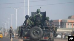 FILE — Nigeria army patrols along the Kaduna Birnin Gwari area in Nigeria, March 8, 2024.