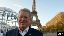 Former US vice president, politician, environmentalist and Nobel Peace Prize winner Al Gore is pictured within an interview with AFP on November 13, 2015 at the foot of the Eiffel Tower in Paris, ahead of the key United nations conference on climate change scheduled in Paris through November 30 - December 11.