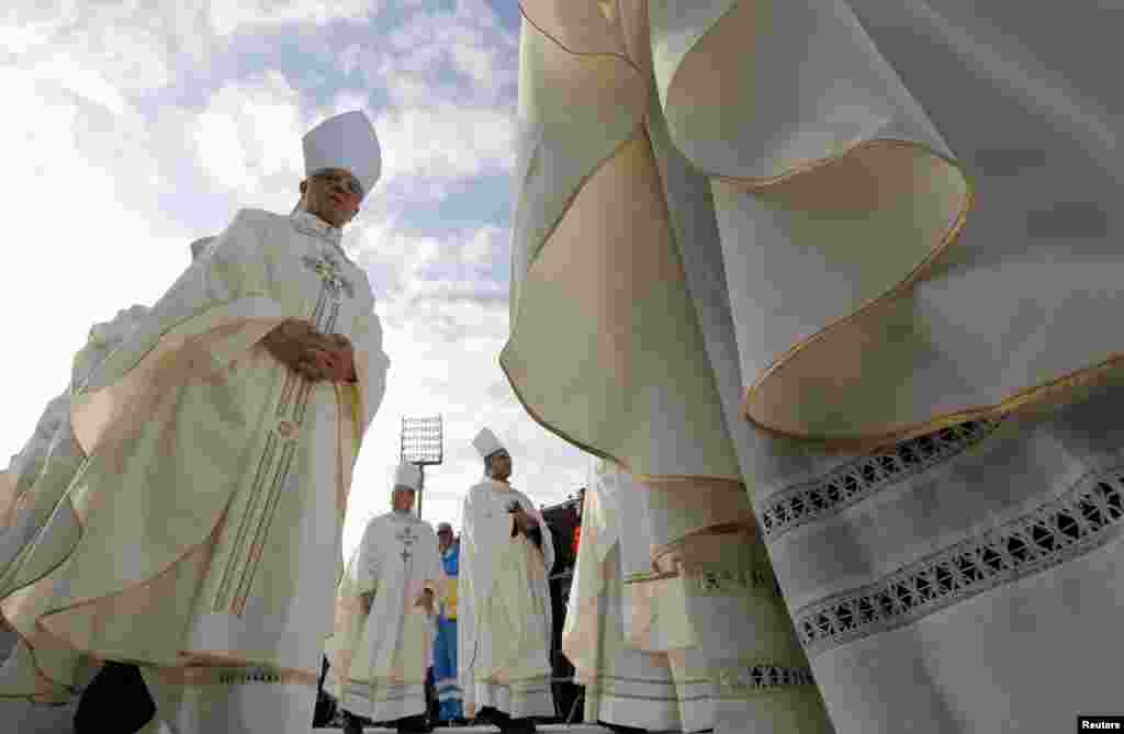 Bishops arrive to attend a mass celebrated by Pope Francis during his pastoral visit in Florence, Italy.