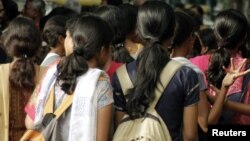 Women stand at a crowded place in the southern Indian city of Bangalore, Oct. 9, 2006. Safety is the biggest concern for women using public and private transport, according to a survey Thursday.