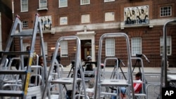 Ladders pile up as journalists prepare at the entrance to the Lindo Wing at St Mary's Hospital in London, July 2, 2013. 