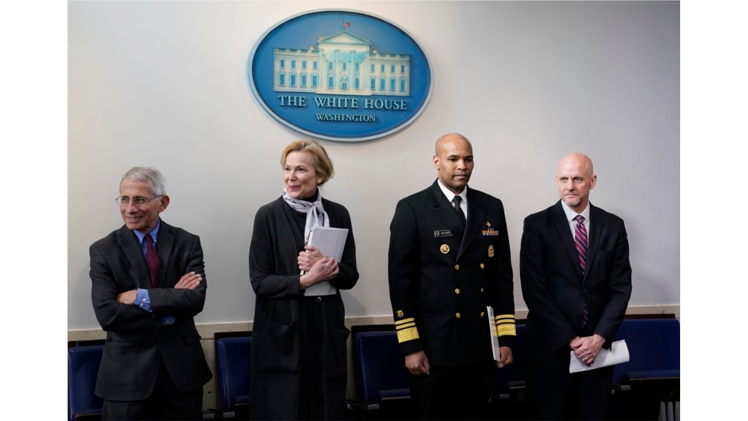 FILE - From left, members of the U.S. coronavirus task force Dr. Anthony Fauci, Dr. Deborah Birx, Jerome Adams, and Dr. Stephen Hahn arrive to attend a coronavirus briefing at the White House, in Washington, April 10, 2020.