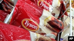 FILE - Tyson packages of frozen chicken are displayed at a supermarket in North Andover, Massachusetts, March 6, 2017.