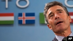 NATO Secretary General Anders Fogh Rasmussen waits for the start of a meeting of the North Atlantic Council at NATO headquarters in Brussels on Tuesday, April 1, 2014