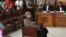 Pemimpin kelompok radikal Islam, Aman Abdurrahman, tengah, duduk di kursi terdakwa saat pengadilan terhadap dirinya di Pengadilan Negeri Jakarta Selatan di Jakarta, Indonesia, Jumat, 18 Mei 2018 (foto: AP Photo/Tatan Syuflana)